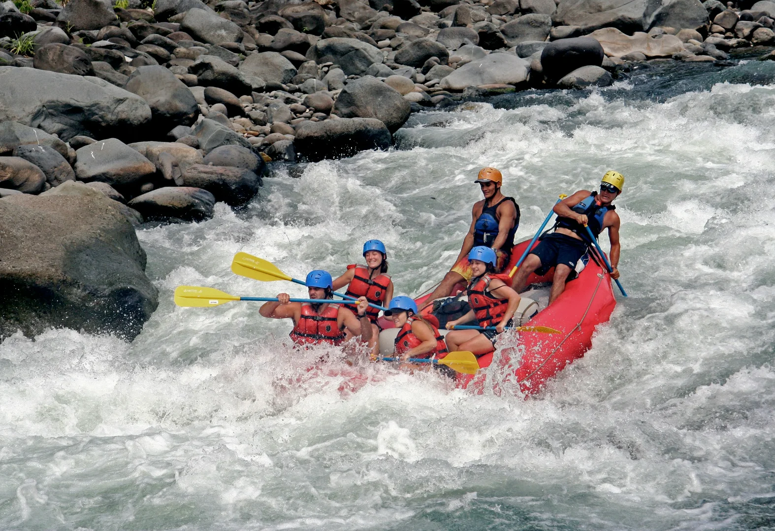 Group of travelers rafting on a river in Costa Rica